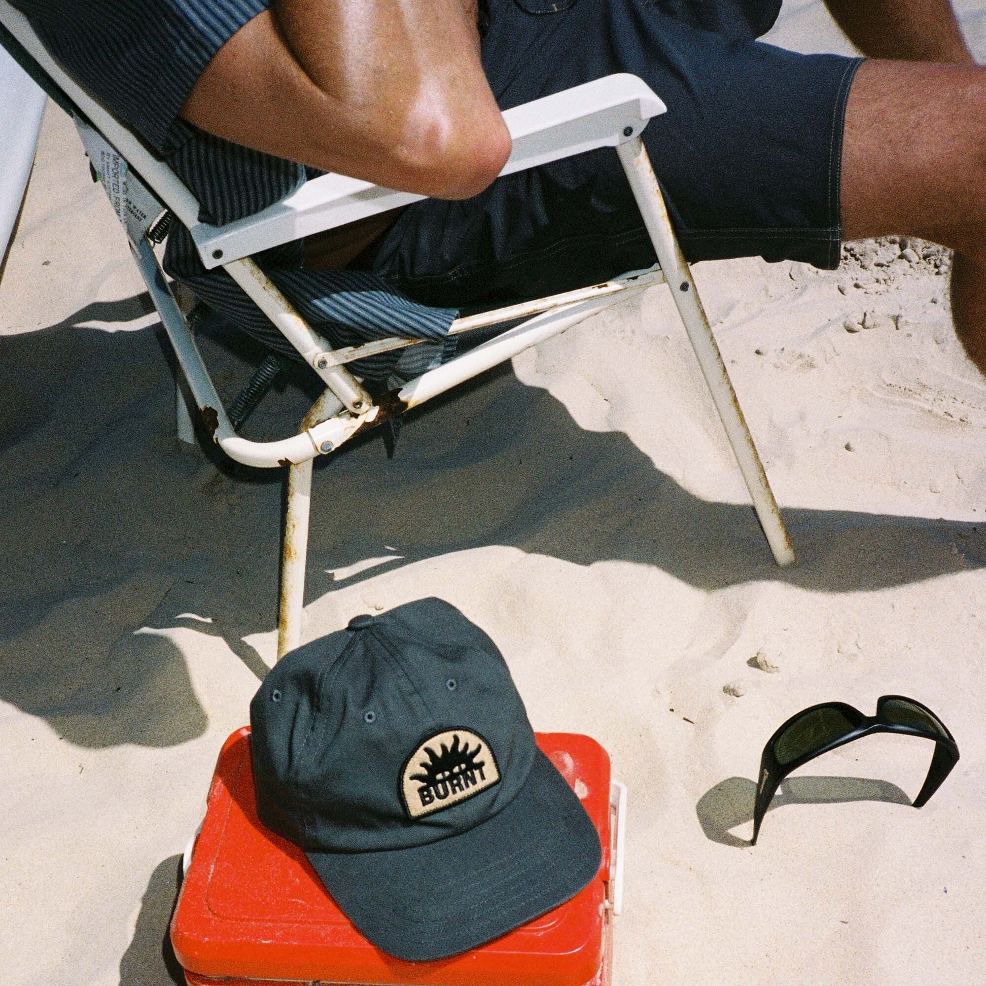 Collection of burnt-tone caps including baseball and cricket caps, perfect for outdoor adventures and travel by Roark.